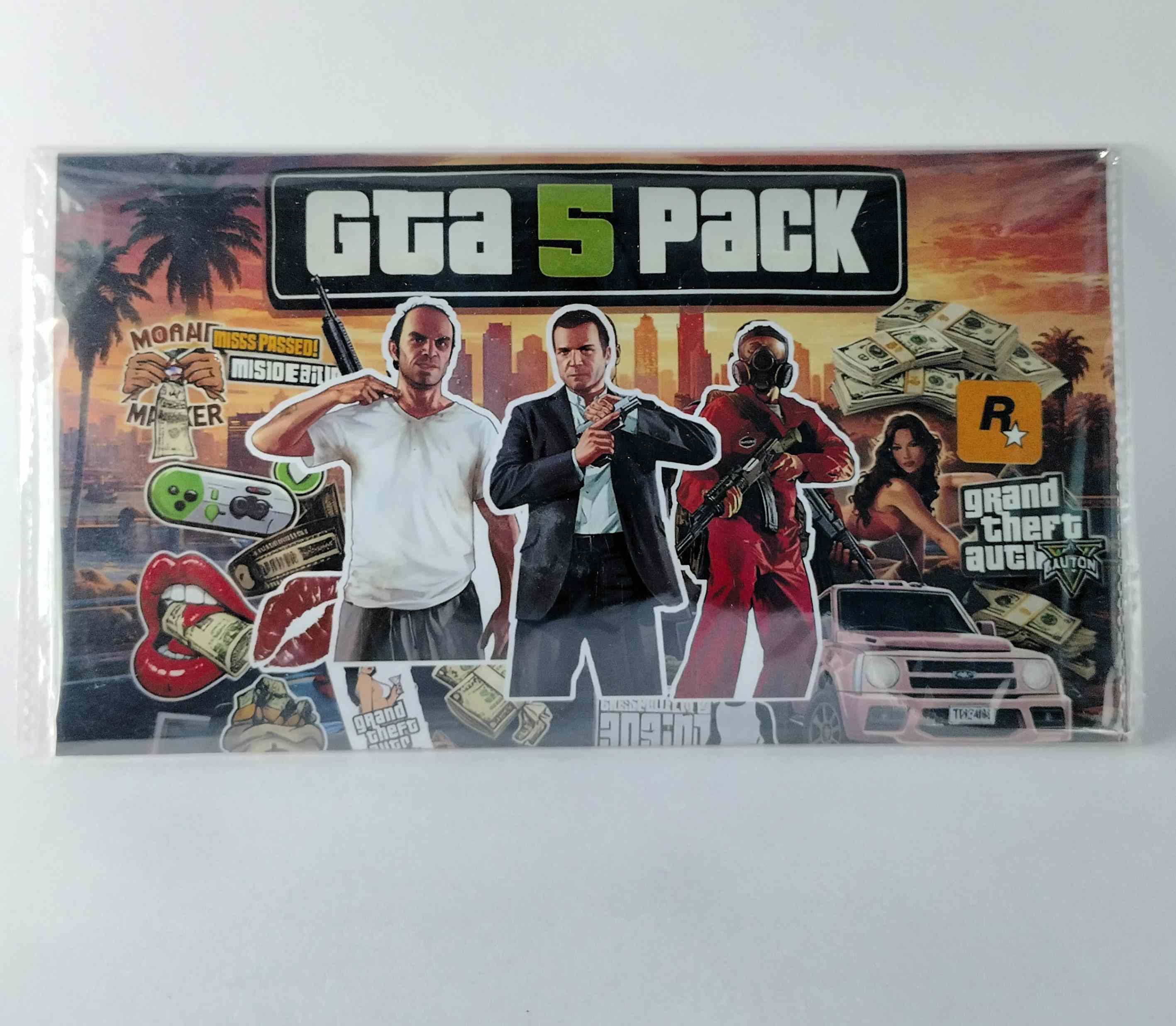 GTA 5 Pack packaging with characters and graphics on a white background