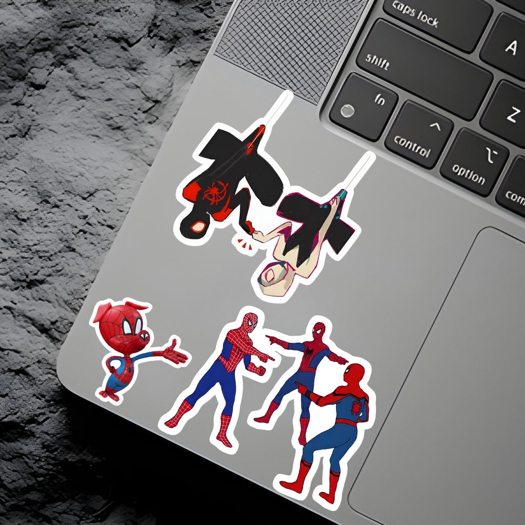 Spider-Man stickers on a laptop keyboard